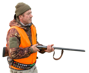 Hunter man in camouflage with a gun during the hunt in search of wild birds or game. Autumn hunting season.