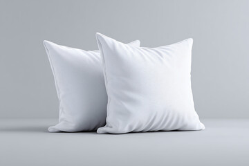 Two fluffy, square pillows, showcasing comfort and relaxation. They are soft and inviting