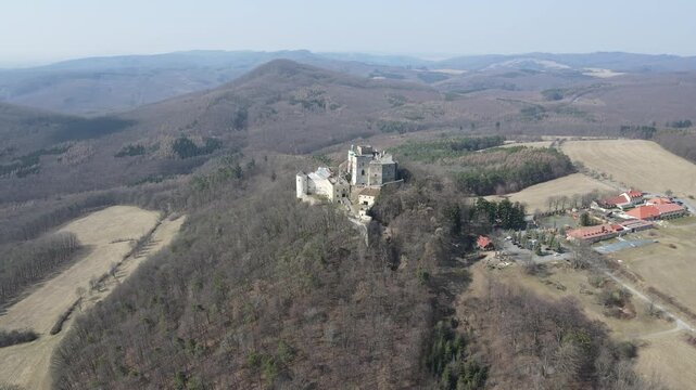 Medieval royal castle Buchlov in South Moravia, Czech Republic captured on drone video. Autumn nature, forests, castle. Drone video.