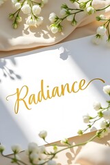 Elegant white blossoms frame a pristine card the word Radiance, in gold lettering, adds a touch of luxurious shine, vertical composition.