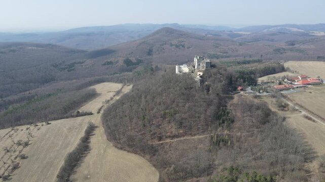 Medieval royal castle Buchlov in South Moravia, Czech Republic captured on drone video. Autumn nature, forests, castle. Drone video.