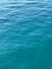 Calm rippling blue water surface background.