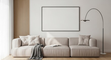 Modern living room with beige sofa, blank picture frame, and lamp
