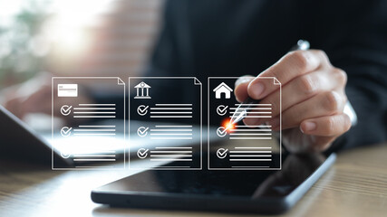 Business hand marking digital checklist of loan, bank, and housing documents on tablet, concept of...