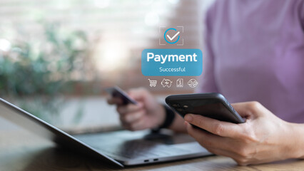 Close-up of hands using a smartphone and a credit card for successful online payment. Concept for...