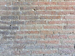 Roman red brick wall closeup 