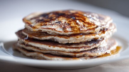 Stack of Golden Brown Pancakes Drizzled with Syrup