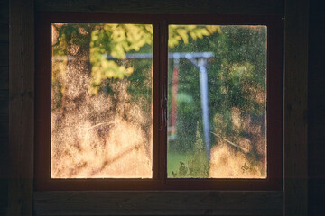 Old dirty window in garden shed. High quality photo