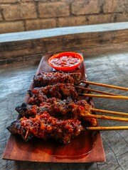 Spice up your day with this mouthwatering grilled satay, drenched in rich, fiery sambal. A perfect...