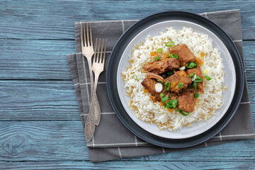 beef slow cooked with gravy served over rice