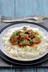 beef slow cooked with gravy served over rice