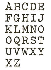 Vintage typewriter-style uppercase English alphabet printed on textured paper, arranged in a neat five-line grid.