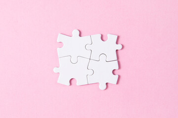 four puzzle pieces connected
