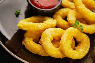 Colmar rings fried food fries fast food crispy appetizer fresh delicious gourmet food background on...