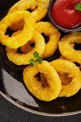 Colmar rings fried food fries fast food crispy appetizer fresh delicious gourmet food background on the table rustic food top view copy space