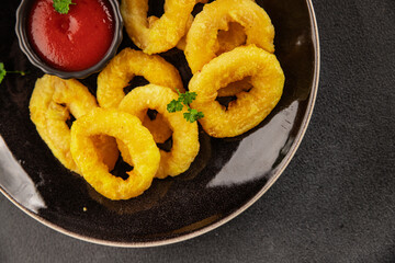 Colmar rings fried food fries fast food crispy appetizer fresh delicious gourmet food background on...
