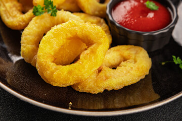 Colmar rings fried food fries fast food crispy appetizer fresh delicious gourmet food background on...