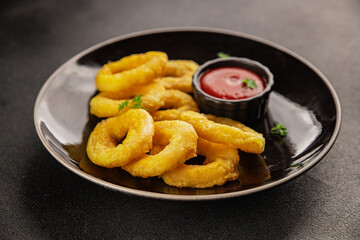 Colmar rings fried food fries fast food crispy appetizer fresh delicious gourmet food background on...