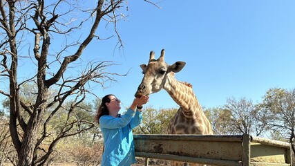 Woman Making a Gentle Connection with a Giraffe