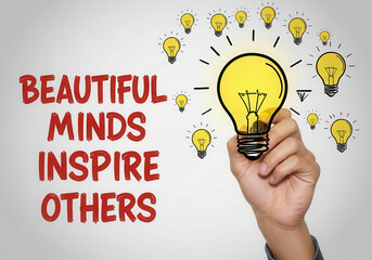 Hand holding a glowing lightbulb with text beautiful minds inspire others