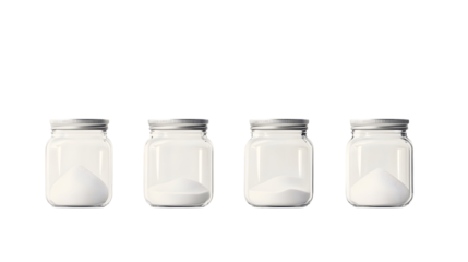 Four glass jars containing different levels of white powder on black background