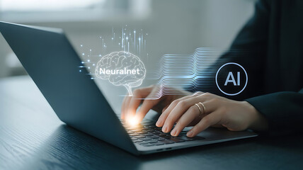 Person using laptop with glowing ai and data visualization overlay