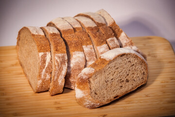 Freshly Sliced Whole Wheat Bread on a Wooden Cutting Board