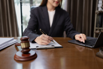 Lawyer Businesswoman Working with Documents and Signing Contract at Office Desk, Hammer on Wood table, Judge's Gavel, Law, Justice Symbol,