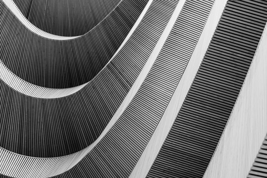 Abstract Architectural Detail of Curved Wooden Slats Creating Modern Rhythmic Patterns in Black and White