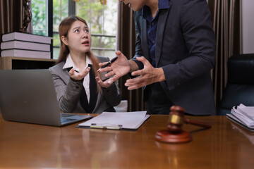 Two Lawyer with Document Paper and Hammer on Wood table,  Judge's Gavel, Law, Justice Symbol, Agreement and Partnership Concept,