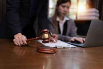 Two Lawyer with Document Paper and Hammer on Wood table,  Judge's Gavel, Law, Justice Symbol, Agreement and Partnership Concept,