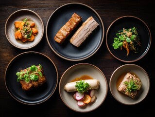 A variety of gourmet dishes artfully plated on black and beige ceramic plates, featuring meats, vegetables, and fresh herbs on a dark wooden table.