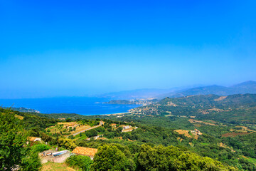 Mountain landscape with haze and view to Gulf of Sagone, France, Corsica, Apietto, 14 June 2025