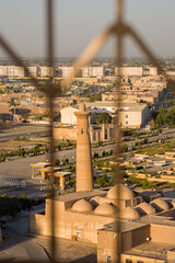 Aerial view through a lattice screen of Khodja Minaret in Uzbekistan