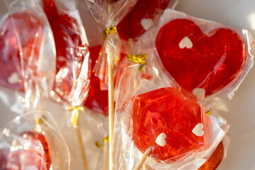 Heart-shaped lollipop in hand