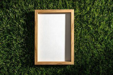 Blank Wooden Frame on Green Grass Ready for Creative Design