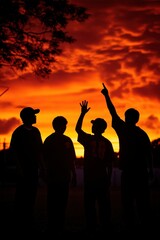 Fototapeta premium Group Participating in Fitness Boot Camp Under Vibrant Sunset Sky