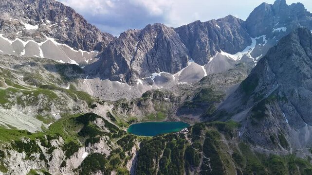 Aerial drone view of the Alps mountains, with Coburger H&uuml;tte located near the scenic lakes Seebensee and Drachensee on a bright, sunny summer day.