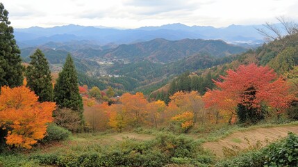 Panoramic autumn vista showcasing vibrant foliage in a mountainous region, with a tranquil village nestled within the valleys