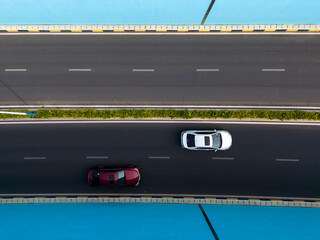 Two Cars on a Bridge: Aerial View of Urban Traffic