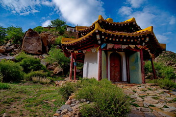 Central Mongolia. The architecture of the abandoned Ovgon Khiid Buddhist monastery is surrounded by picturesque mountain remains.