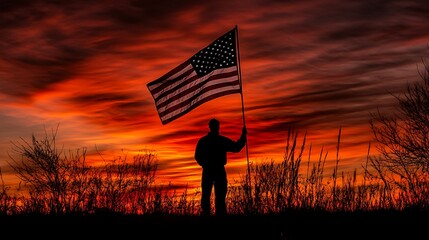 Silhouette of Person Holding American Flag at Sunset