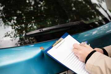 Insurance agent draws up documents after accident. Services of insurance companies concept
