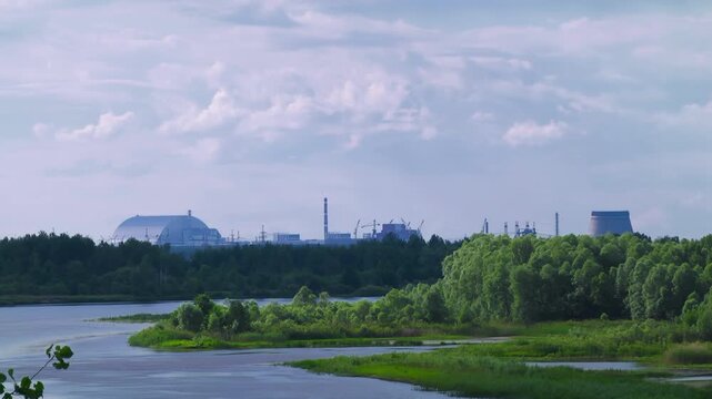 Chernobyl Nuclear Power Plant with New Safe Confinement. Pripyat River. Ukraine