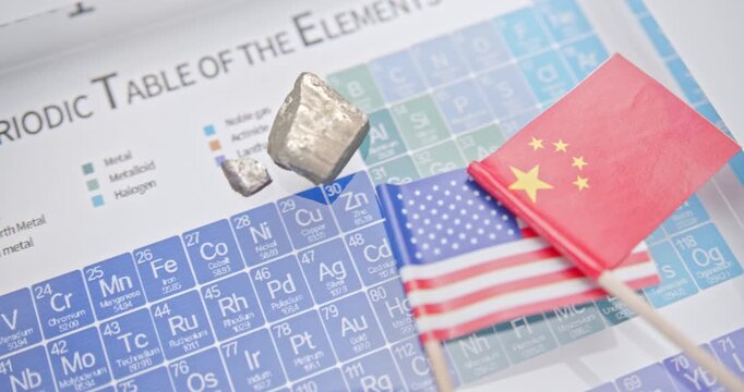 China - US trade war, atomic or rare earth diplomacy: A periodic table, mineral samples (rare earths or refined critical elements) rest on top of the table, symbolizing the raw material control.
