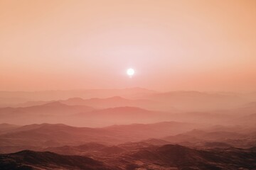 Dramatic sunset over a summer desert landscape with red sun illuminating the hills Generative AI