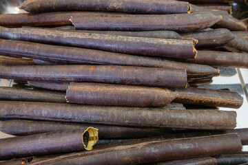 Stacked Cinnamon Sticks in a Market Display