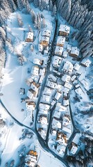 Aerial View of SnowCovered Mountain Village with Roads and Evergreen Trees in Winter