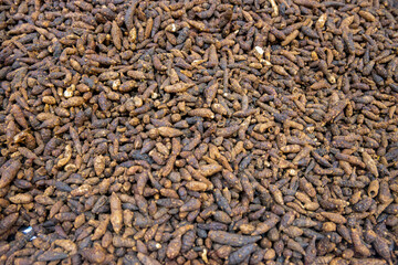 A Large Pile of Dried Herbs with Varied Shapes and Sizes