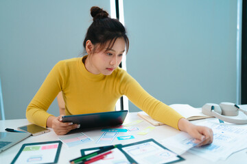 Portrait of Young creative startup woman at workplace